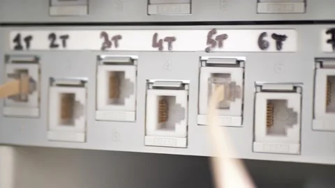 IT Engineer Patching Network Equipment In Server Room. Network Engineer Stock Footage 203978141