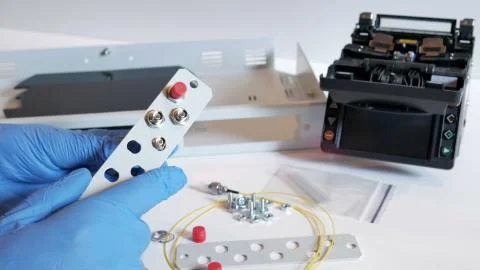 IT Engineer is a patching network equipment in server room. Stock Photos