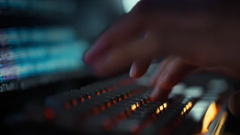 An IT engineer rapidly types complex algorithm codes computer keyboard enhan Video stock 331866672
