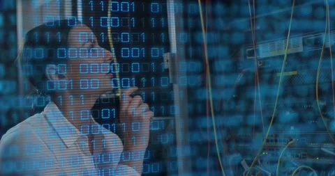 IT engineer receiving call and diagnosing network issue by reseating rack cable Stock Footage 310643875