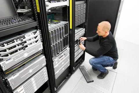 It engineer replace harddrive in datacenter Stock Photos