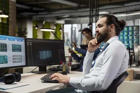 IT engineer reviewing data analysis results with artificial intelligence Stock Photos
