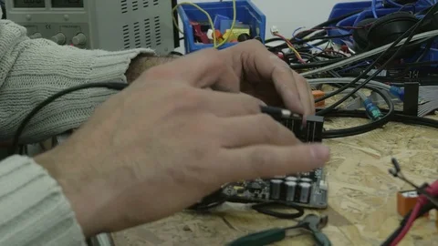 IT engineer soldering electronic micro elements on motherboard by Pakito. Video stock 71220587