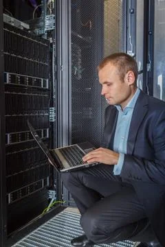 IT Engineer working on a laptop Stock Photos