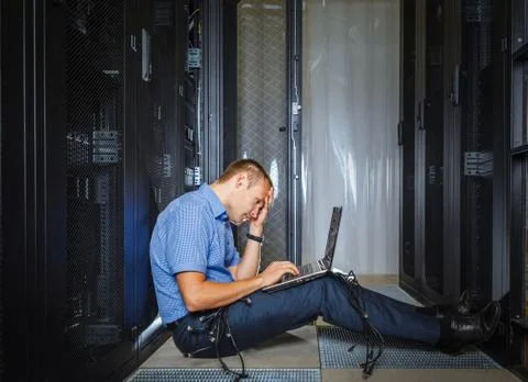 IT Engineer working on a laptop Stock Photos