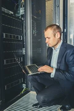 IT Engineer working on a laptop Stock Photos