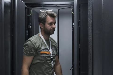 IT engineer working In the server room or data center The technician puts in a Stock Photos