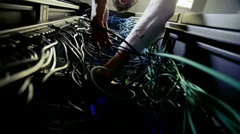 IT engineer working on server wiring in a data centre Stock-Footage 21466691