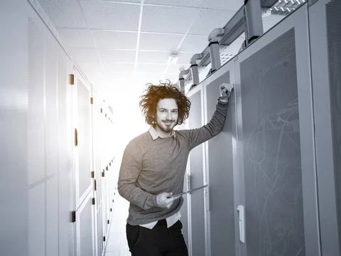 IT engineer working on a tablet computer in server room Male IT engineer w... Stock-Fotos