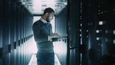IT Engineer Works on Laptop in Data Center Stock Footage 320999576