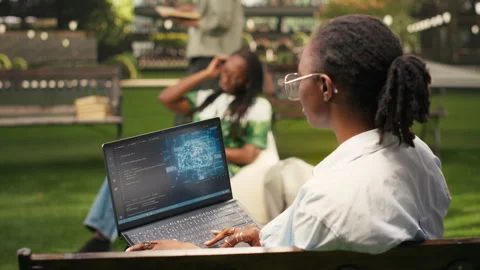 IT engineering student using AI and binary code on laptop screen Stock Footage 340961517