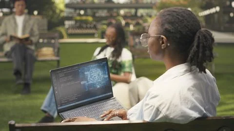 IT engineering student using AI and binary code on laptop screen Stock Photos
