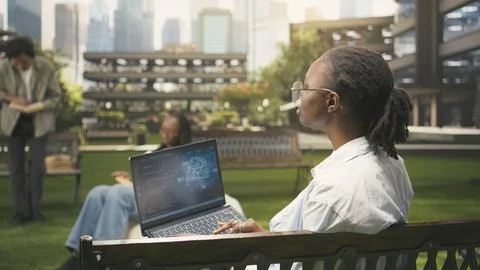 IT engineering student using AI and binary code on laptop screen Stock Photos