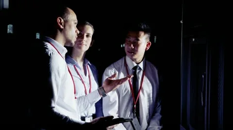 IT engineers in a data centre having a discussion about the servers Stock Footage 21475677