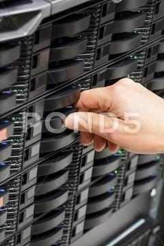 IT Engineer's Hand Installing Hard Drive At Data Center Stock Photos