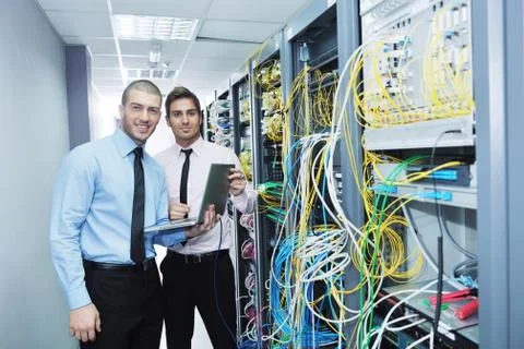 It engineers in network server room Stock Photos
