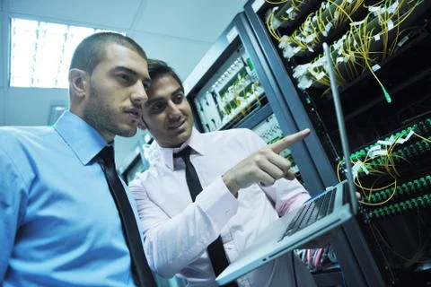It engineers in network server room Stock Photos