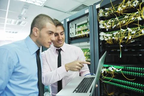 It engineers in network server room Stock Photos