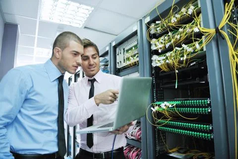It engineers in network server room Stock Photos