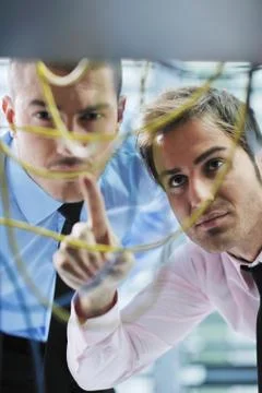It engineers in network server room Stock Photos