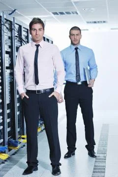 It engineers in network server room Stock Photos