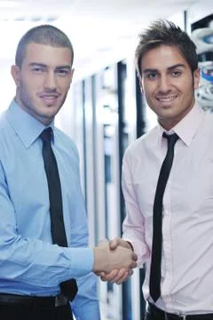 It engineers in network server room Stock Photos