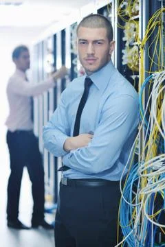 It engineers in network server room Stock Photos