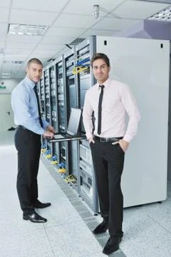 It engineers in network server room Stock Photos