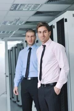 It engineers in network server room Stock Photos