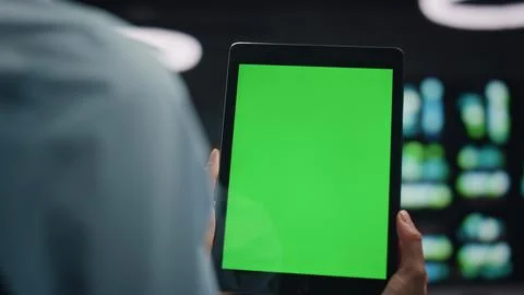 IT engineers using tablet chroma key researching network at datacenter closeup 写真素材