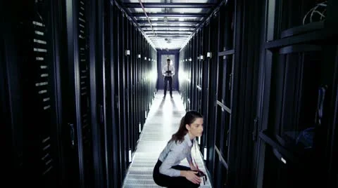 IT engineers working in a data centre Stock Footage 21447000