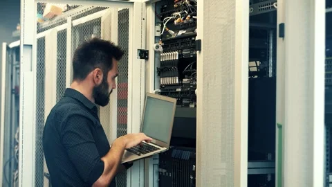 It enginer in server room.programmer in data center.network engineer Stock Footage 261143332