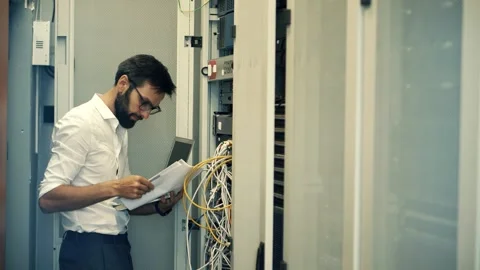 It enginer in server room.programmer in data center.network engineer Stock Footage 261143887