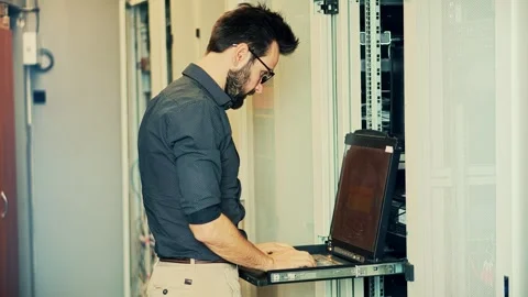 It enginer in server room.programmer in data center.network engineer Stock Footage 261144882