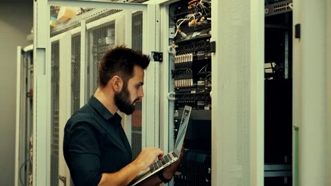 It enginer in server room.programmer in data center.network engineer Stock Footage 261177419