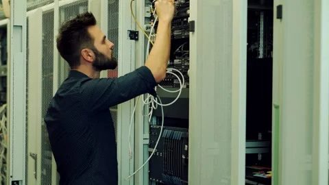 It enginer in server room.programmer in data center.network engineer Stock Footage 261185202