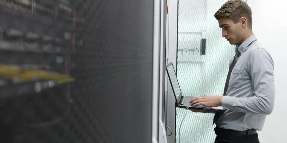 IT expert checking supercomputer server IT expert checking supercomputer s... Stock-Fotos