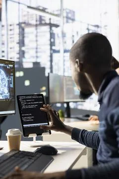 IT expert doing artificial intelligence programming using tablet 스톡 사진