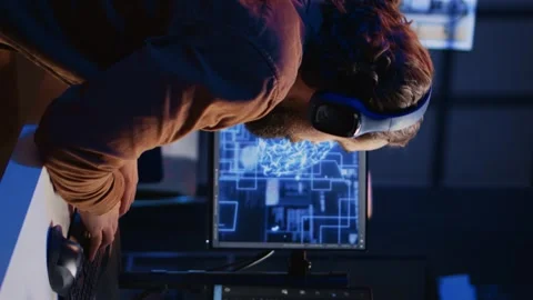IT expert enjoying coffee and audio podcasts while writing AI code Stock Footage 265107003