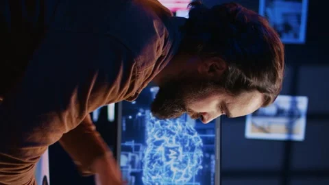IT expert enjoying hot beverage while running AI simulations Stock Footage 265107482