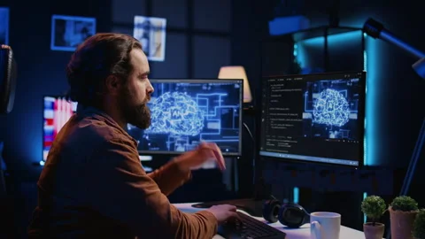 IT expert enjoying hot beverage while running AI simulations Stock Footage 265618076