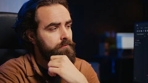 IT expert feeling confused while trying to solve database bugs Stock Photos