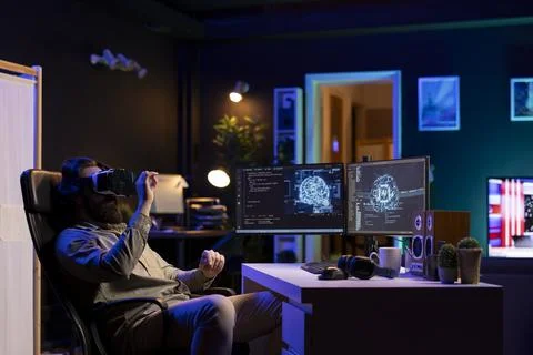 IT expert programming using virtual reality tech to upgrade AI brain Stock Photos