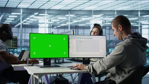 IT expert supervising data center supercomputers using mockup computer monitor Stock Footage 319269295