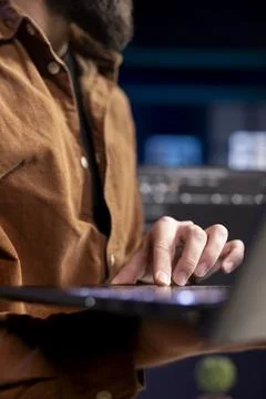 IT expert taking care of security exposures in operating system, close up 写真素材