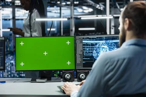 IT expert using green screen PC in server hub Stock Photos