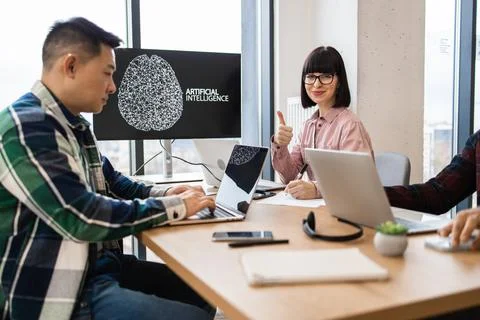 IT experts collaborating on artificial intelligence development Stock Photos