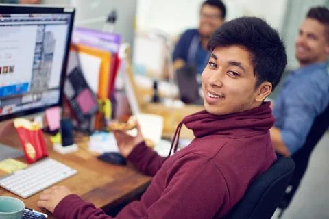 The IT experts. Shot of employees in an IT office. Stock Photos