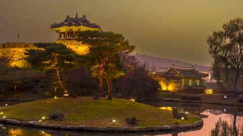 As it gets dark, Dongbuklu and Yongyeon are lit up and it is beautif. Zoom in 스톡 동영상 260879272