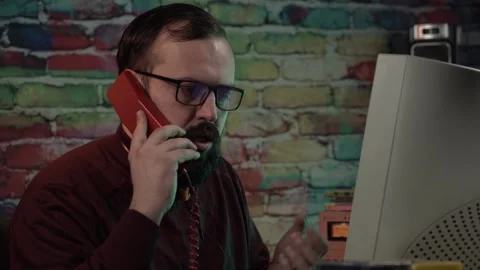 IT Guy From 1990'z Arguing Over Landline Telephone During Phone Call in Front Stock Footage 306344689